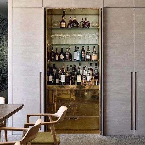 Is it time yet? 🍸😋🍸obsessing over this concealed brass bar from @b.e_architecture Bar In Niche, Bar Millwork Design, Hidden Built In Bar, Cabinet Around Mini Fridge, Bar Joinery Design, Bar In Cupboard, Office Liquor Cabinet, Dry Bar Ideas Small Living Room, Hidden Bar Design