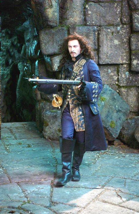 "Peter Pan" (2003) As 'Mr. Darling,' he’s the emotionally absent (but dapper) dad… But in Neverland, he’s a HOT HOT 'Captain Hook' w/ a wig & goatee (& wardrobe) to die for | Why is Jason Isaacs so hot? I think it’s because he plays a baddie so well. I mean, he’s probably a really great guy who rescues kittens from storm drains … but put him into tight pants & let him glower a bit & I’m suddenly fanning myself! Let’s take a look at Jason’s historical roles. Pantomime, Original Peter Pan, Hook Costume, Peter Pan Jr, Captain Hook Costume, Peter Pan 2003, James Hook, Peter Pan Movie, Jason Isaacs