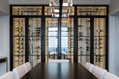 Contemporary Dining Room with Metal Wine Rack Wine Wall Dining Room, Wine Cellar Wall, Wall Dining Room, Wine Room Design, Traditional Decor Southern, Dining Room Interior Design, Glass Wine Cellar, Wine Closet, Luxury Wine