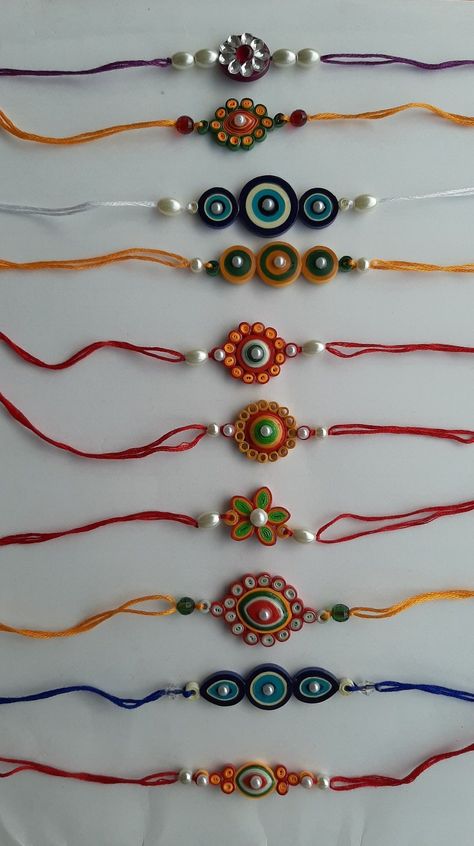 Quilling Paper Art/very beautiful paper craft Quiling Rakhi Ideas, Quilling Rakhi Ideas, Quiling Earings Ideas, Paper Quilling Rakhi Design, Raki Design, Raki Making Ideas, Rakhadi Designs New, Quelling Rakhi, Quilling Rakhi Handmade