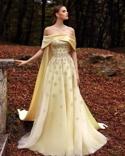 A Feminine pastel yellow color dress with flowing maxi cut made from tulle & Mikado cape. This dress is fully embroidered with scattered… | Instagram Pastel, Homecoming Dresses Bodycon, Yellow Evening Dresses, Rich Fashion, Off Shoulder Wedding Dress, Yellow Gown, Cape Wedding Dress, Beach Wedding Dress Boho, Dream Wedding Ideas Dresses