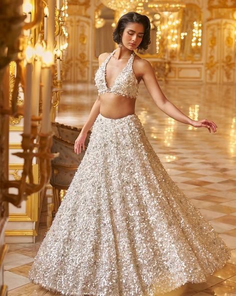 Inara by Seema Gujral Elegance meets opulence in this intricately adorned lehenga, boasting exquisite three-dimensional embroidery. The… | Instagram White Bridal Lehenga, Sequin Lehenga, Seema Gujral, Gold Lehenga, Blouse Necklines, White Lehenga, Indian Bridesmaid, Full Sleeve Blouse, Lehenga Designs Simple