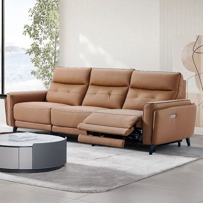 Introducing our deluxe Top Grain Leather and Leather match three-seat sofa. This sofa features a stylish design and a host of practical features that make it the centerpiece of any living room. The sofa boasts one electric function position is facing the right-hand, providing convenient access to essential controls and adding personalized support. The sofa seat cushions, backrests, and armrests are covered in Top Grain Leather for a touch of class and elegance, while the outer sides of the armre Leather Reclining Loveseat, Lilac Garden, Leather Couches, Leather Couches Living Room, Couches Living, Sofa Seat Cushions, Sofa Leather, Match Three, Living Room Setup