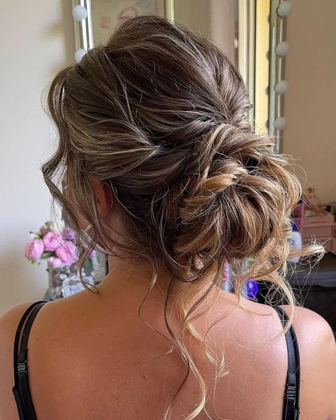 20 Beautiful Messy Bun Hairstyles For Wedding | Hairsassy Loose Messy Low Bun Wedding Hairstyles, Updo Low Bun Hairstyles, Low Messy Bun Thick Hair, Styled Messy Bun, Curly Messy Bun Wedding Hair, Prom Messy Bun Hairstyles, Low Messy Bun Prom, Messy Prom Hair Updo, Messy Bun For Prom