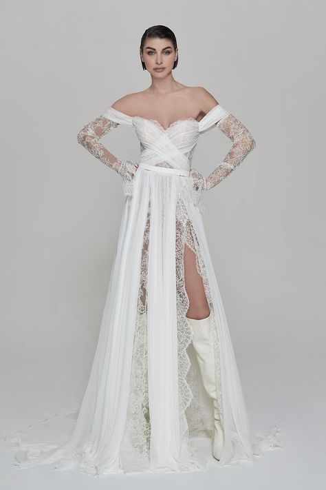 A dress that represents an edgy bride perfectly with it off-the-shoulder neckline and sheer Chantilly long sleeves. The bodice is decorated with a crossed tulle design, then cascades down in a flowy skirt with double front slits decorated with scalloped lace for a romantic daring bridal look! Find this gown by Maison Signore at Esposa Privé Dubai! Wedding Lingerie, Edgy Bride, Kimono Lingerie, Flare Gown, Silly Goose, Dress Flowy, Dream Wedding Ideas Dresses, Bridal Look, Bridal Robes