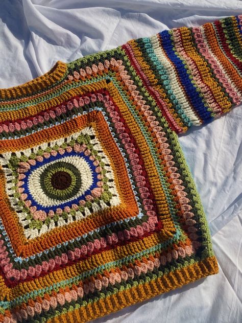 Colourful Crochet Sweater, Crochet Eye Cardigan, Evil Eye Sweater Crochet, Multicolor Crochet Sweater, Evil Eye Crochet Sweater, Earthy Crochet Projects, Masc Crochet Ideas, Wool Crochet Ideas, Crochet Sweater Aesthetic