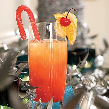 Jingle Juice: Use candy canes as fun garnishes for this orange juice and vodka cocktail. Its red-orange color comes from the addition of maraschino cherry juice. Aperitif, Jingle Juice Recipe, Orange Juice And Vodka, Jingle Juice, Cherry Juice, 12 December, Holiday Cocktail Recipe, Vodka Cocktails, Christmas Cocktails