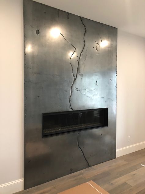 Cold Rolled Steel Fireplace, Textured Tile Fireplace Surround, Concrete Overlay Fireplace, Black Metal Fireplace Surround, Modern Tile Fireplace Surround, Covering A Fireplace Ideas, Linear Fireplace Surround Ideas, Microcement Fireplace, Cement Fireplace Surround