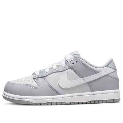 The Nike Dunk Low Two Toned Grey is a classic sportswear staple. Its iconic toebox perforations are just one part of its appeal, with eye catching details like white shoe laces and splashes of grey and blue in the tongue making it stand out even further. On top of the classic black sole, you'll find a white midsole and striking patches of grey leather on a white base. The design is complete with the famous swoosh made from white leather. If you’re looking for classic street style with an edge, Trendy Shoes Under 100, Grey Dunks Low, Shoes To Go With Every Outfit, Cute Shoes For Back To School 2024, Low Grey Dunks, Back To School Shoes Dunks, Cute Shoes To Get For School, Grey And Black Dunks, White And Grey Dunks