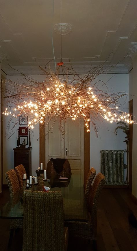 Tree branch chandelier with fairy lights Tree Branch Chandelier Entryway, Stick Chandelier Tree Branches, Tree Branch Chandelier Diy, Diy Tree Chandelier, Tree Branch Lighting Diy, Indoor Branches With Lights, Branches Ceiling Decor, Branch Lights Decor, Branch Fairy Lights