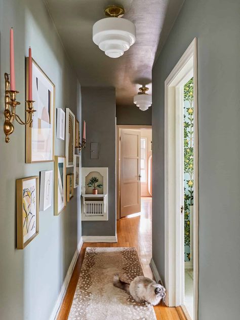 Hallway With Painted Ceiling, Small Hallway Designs, Hallway Gallery Wall With Lights, Long Hallway Runners Ideas, Decorate Long Narrow Hallway, Decorate Long Hallway, Behind Door Decor, Gallery Wall Hallway Narrow, How To Decorate A Hallway