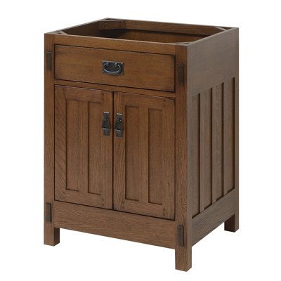 This American Craftsman vanity collection has been inspired by the Arts and Crafts style. The cabinets feature inset doors and drawers, mortise and tenon details, and matching decorative hardware. Crafted from select oak solids and veneers and finished in a beautiful and durable finish will ensure enduring function and beauty for your bath interior. | Sagehill Designs American Craftsman 24" Single Bathroom Vanity Base Only in Rich Amber Wood / Solid Wood in Brown / Gray | 34 H x 24 W x 21 D in | Craftsman Style Powder Room, Craftsman Style Bathroom Vanity, Craftsman Style Bathrooms Small, Craftsman Style Bathroom Ideas, Craftsman Vanity, Mission Style Bathroom, Craftsman Style Bathroom, Craftsman Interior Doors, Craftsman Bungalow Exterior