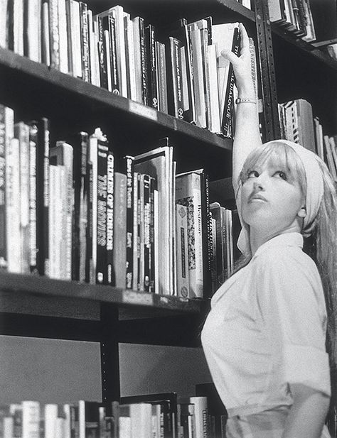 The luscious librarian. Photograph by Cindy Sherman.    Untitled Film Still #13. 1978. Gelatin silver print. The Museum of Modern Art, New York. Â© 2012 Cindy Sherman.    The sixty-nine solitary heroines map a particular constellation of fictional femininity that took hold in postwar America—the period of Sherman’s youth, and the ground-zero of our contemporary mythology. In finding a form for her own sensibility, Sherman touched a sensitive nerve in the culture at large. Fondation Louis Vuitton, Cindy Sherman Film Stills, Cindy Sherman Photography, Untitled Film Stills, Metro Pictures, Stephen Shore, Feminist Artist, Exposition Photo, Tableaux Vivants