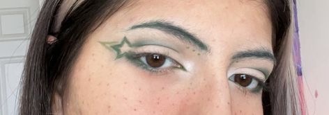 Dinosaur Eyeliner, Star Shaped Eyeliner, Graphic Green Eyeliner, Green Star Makeup, Green Y2k Makeup, Leaf Eyeliner, Green Graphic Eyeliner, Green Eyeliner Looks, Green Eyebrows