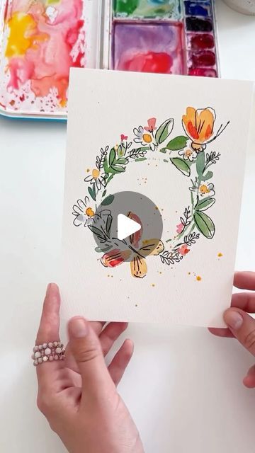 Anna Koliadych on Instagram: "Easy and fun wreath using watercolor with summer vibes 🌿🦋 🌼🥰 #watercolor #watercolortutorial #inspiration #watercolorillustration #craft #diy" Easy Watercolor Inspiration, Hand Painted Watercolor Cards, Diy Watercolour Card, Cute Watercolor Cards, Watercolor Cute Art, Watercolour Easy Painting, Aquarelle Art Ideas, Easy Watercolor Cards Ideas, Water Colour Ideas