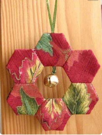 Hexi Christmas Ornament is a great "carry along project"! Use the GO! English Paper Piecing Hexagon, sew hexagons together to make small wreaths, then sew front and back wreaths together on the machine. EASY! #accuquilt #christmasornaments #cuttimequiltmore Hexagon Wreath, Door Ornament, Christmas Patchwork, Christmas Quilting, Wreath Ornament, Ornament Diy, Quilted Christmas Ornaments, Christmas Idea, God Jul