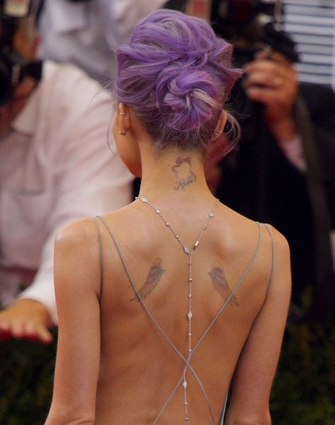 Nicole Richie showing off a sexy back that showed her angel wings, along with two other small tats on the back of her neck Nicole Richie, Angel Wings Tattoo On Back, Small Angel Wing Tattoo, Wing Tattoos On Back, Small Tats, Angel Wings Tattoo, Tattoo Small, Wings Tattoo, Celebrity Tattoos