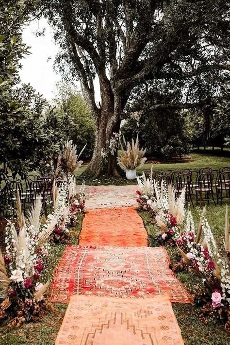 7 Traditional And Modern Wedding Ceremony Ideas To Make Your Wedding Day Memorable ❤ wedding ceremony ideas outdoor woodland ceremony with pampas grass flowers and carpets in the aisle elisabettalillyred #weddingforward #wedding #bride #weddingdecor #weddingceremonyideas #bohowedding #weddingceremonyideas Bohemian Inspired Wedding, Unique Arbors Wedding, Quiet Wedding Ideas, Outdoor Wedding Aisle Ideas Boho, Lighted Pathway Wedding, Unique Aisle Runner, 70s Outdoor Wedding, Couches Outside Wedding, Backyard Boho Wedding Receptions