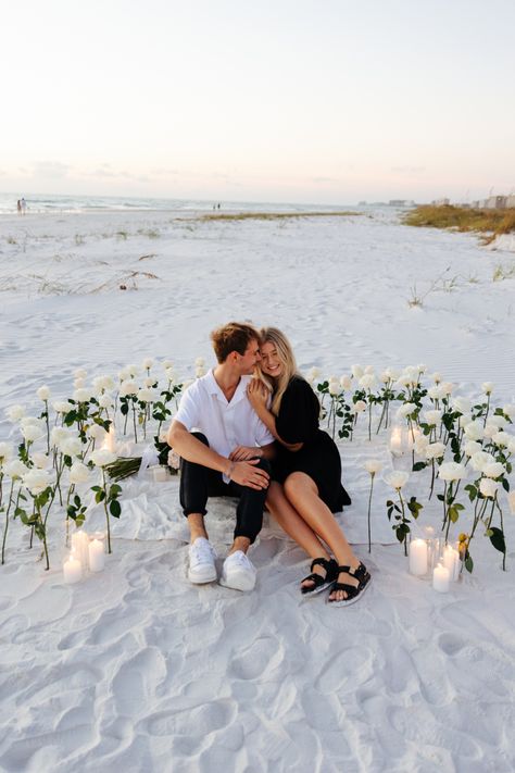 White Roses And Candles Proposal, Propose On The Beach, Diy Beach Proposal, Engagement At The Beach, Marriage Proposal Beach, Dress For Proposal Engagement, Beach Proposals Ideas, White Rose Proposal, Sunrise Beach Proposal