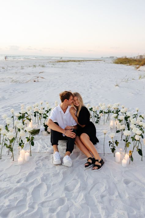 White Roses And Candles Proposal, Propose On The Beach, Diy Beach Proposal, Proposal Ideas Beach Simple, Engagement Beach Ideas, Proposal White Roses, Beach Proposal Outfits For Her, Dress For Proposal Engagement, Florida Proposal Ideas