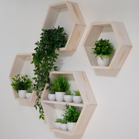 PRICES MAY VARY. LARGE SET OF 4 + MIDDLE SHELF – Add a modern touch to any room with our large hexagon floating shelves, perfect for displaying your favorite décor items, plants or collectibles. Our largest hexagon measures 18” wide much bigger than competitors, providing more surface area for functional storage and creates a more dramatic visual impact on your walls. SCOTCH PINE WOOD – Crafted from high quality wood, these hexagon shelves are built to last. Each shelf is hand stained and protec Hexagon Living Room, Hexagonal Shelf, Hexagon Wall Shelves, Hexagon Wall Decor, Hexagon Floating Shelves, Honeycomb Shelf, Hexagon Wall Shelf, Crystal Display Shelf, Hexagon Wall