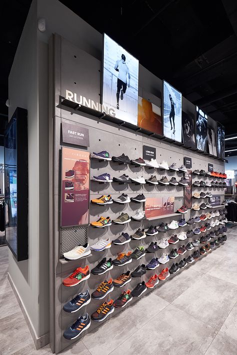 The interior of the Adidas store is contemporary and stylish. To suit the brief, Cemcrete’s CreteCote in Nickel Grey was further used for the display shelving. A magnificent backdrop for some of the brand’s quality product offerings! Adidas Store Display, Adidas Store Interior, Running Store Design, Adidas Store Design, Sport Shop Design, Sports Store Design, Sports Shop Interior Design, Sport Store Design, Shoes Shop Design