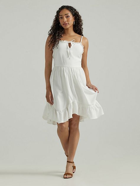 DRESSED LIKE A DAYDREAM Achieving summery elegance is as easy as wearing our Women’s Wrangler Retro® Ruffle Dream Tank Dress. It’s crafted from rayon for a buttery soft feel that’s perfect for warm days. This midi dress comes with a flattering tie-front bodice, adjustable straps, and an asymmetrical hemline with ruffles ready for whirling and showing off your best moves. Women's Dresses, Dressed Like A Daydream, Wrangler Dresses, Cowgirl Dresses, Grad Dresses, Dreamy Dress, Tank Dress, Jumpsuit Dress, Jumpsuits For Women