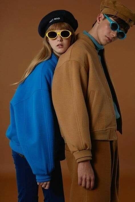 Leaning On Each Other Pose, Duo Photoshoot Ideas Aesthetic, Bold Color Photoshoot, Photoshoot Brown Background, Jacket Photoshoot Ideas, Vogue Inspired Photoshoot, Brown Background Photoshoot, Colourful Photoshoot, Jacket Photoshoot