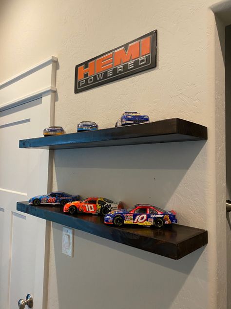 Floating Shelves Mens Bedroom, Shelf Decor Bedroom Men, Car Bedroom Ideas For Men, Car Lover Room Ideas, Jdm Car Room Decor, Car Decor For Bedroom, F1 Shelf, Car Guy Bedroom Aesthetic, Car Guy Room Aesthetic