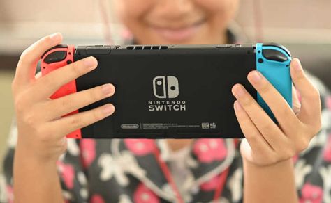 The 8 Best Nintendo Switch Games The Entire Family Will Love - Filter Free Parents Holding Switch Reference, Playing Nintendo Switch Pose Reference, Person Playing Nintendo Switch Pose, Holding Nintendo Switch Reference, Playing Nintendo Switch Pose, Nintendo Switch Art, Visual Drawing, Best Nintendo Switch Games, Drawing Library