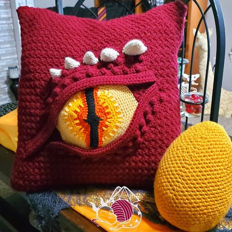Crochet a Dragon Eye Pillow, From The Imagination of Kati Brown Of Hooked By Kati … Yet Another Distinctive Design! | KnitHacker Amigurumi Patterns, Tela, Dragon Eye Pillow, Spooky Front Door, Crochet Cupcake, Skull Wreath, Crochet Hack, Crochet Cushion Cover, Crochet Pillows