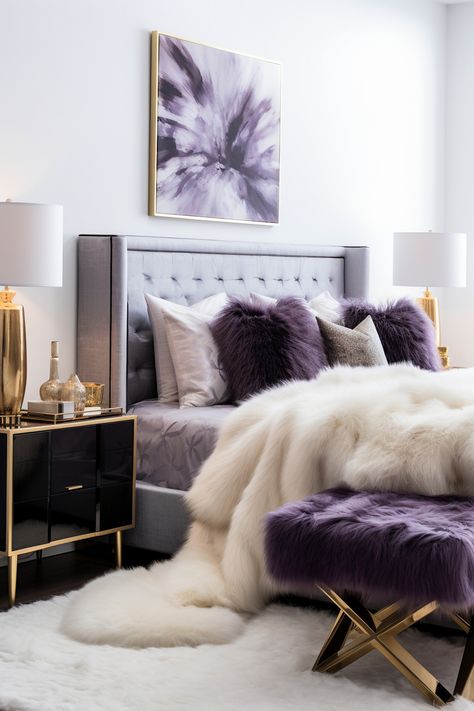 Plush comfort takes center stage in this Modern Boho Bedroom featuring royal purple velvet upholstery on the bed and accent chair. White walls provide a crisp contrast, accented by geometric gold mirrors. A black vintage vanity and a shaggy faux fur rug complete the look. Glam Bedroom Ideas Luxury, Bedroom Ideas With Couch, Bedroom With Couch Layout, Guest Bedroom Bedding, Glam Bedroom Ideas, Vibe Bedroom, Purple Bedroom Decor, Boho Bedroom Design, Guest Bedroom Design