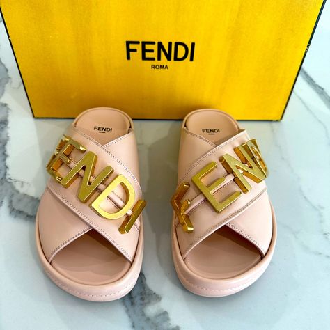 Brand New In Box. 100% Authentic Fendi Fendigraphy Logo Slide Sandals Size 35 Fits Us Size 6 - For Reference I Wear A Size 6 And Size To 35 Color -Light Rose (Blush Pink) Fendi's Sandals Are Constructed Of Smooth Pale Pink Calfskin Leather With A Chunky Platform Sole. Embellished With Oversized Golden Metal Lettering Gleaming Atop The Crisscross Straps Of This Sporty Platform Slide Made Of Supple Calfskin Leather With A Comfortable Contoured Footbed. Composition 100%Calf-Leather - Inside:100%Cal Pink Slides, Slides For Women, Replica Shoes, Shoe Tags, Black Puffer, Leather Slides, Designer Sandals, Shoe Game, Tote Backpack