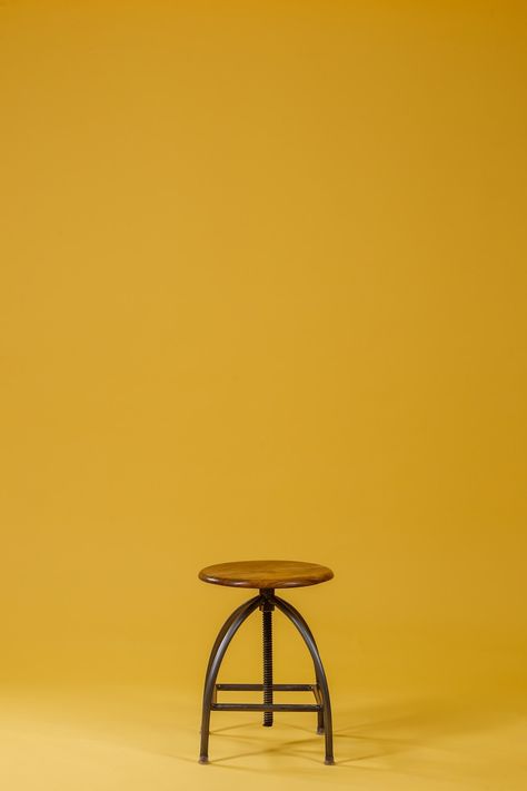 round brown wooden top and black base chair on yellow background photo – Free Furniture Image on Unsplash Background Furniture, Black Stool, Art Coquillage, Photoshop Digital Background, Desktop Background Pictures, Blurred Background Photography, Blur Background Photography, Black Background Photography, Studio Foto