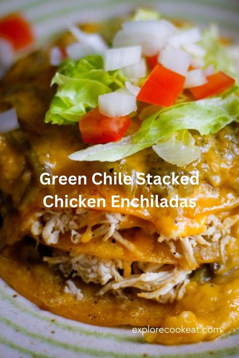 A plate containing stacked chicken enchiladas smothered with melted cheese and topped with chopped tomatoes, onion, and shredded lettuce. Mexico, New Mexico Enchiladas Recipe, Enchiladas Dinner, Stacked Enchiladas, New Mexico Green Chile, Green Chili Chicken Enchiladas, Green Chili Enchiladas, Green Chile Enchilada Sauce, Green Chile Enchiladas