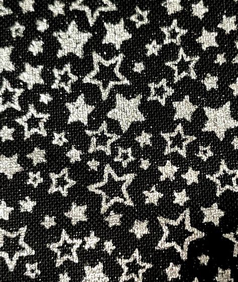 "Onyx Stars Fabric Silver Metallic Stars on Black Holiday Charms Fabric by Robert Kaufman Fabric is listed and priced by the half yard. Each order is cut from the bolt and will arrive as one continuous piece of fabric. Silver metallic stars adorn black cotton fabric. Fun for those Christmas projects. 100% cotton (woven, not knit/stretch) 44/45 inches wide 6\" pattern repeat This fabric is priced by half-yard increments. When you enter 2 under quantity, you will receive a 1 yard piece of fabric. Stars, Stars Silver, Stars Fabric, Sewing Material, Robert Kaufman, Silver Metallic, Onyx, Charms, Yard