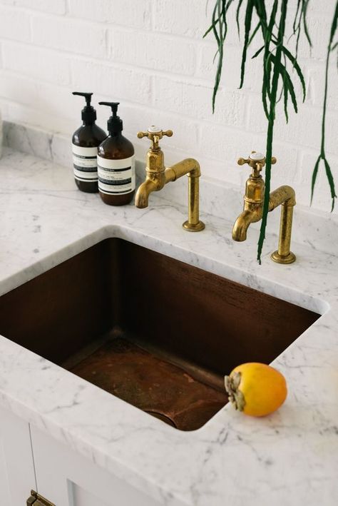 Aged copper sink and faucet with white and gray marble counter top Brass Taps, White Kitchen Inspiration, Copper Taps, Devol Kitchens, Brass Tap, Aged Copper, Rustic Kitchen Design, Copper Sink, Undermount Kitchen Sinks
