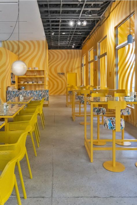 Bringing a dose of maximalism to Miami, Fendi Caffè has opened the doors to its pop-up cafe, revealing a bright yellow interior that’s wrapped in pattern. Located in the city’s Design District, the space is fresh from a total renovation. Photography: Fendi #maximalism #fendi #fendicafe #cafe #miami #interiors #popup #design #interiorarchitecture #yellow #pattern Miami Cafe, Yellow Restaurant, Hotel Hoxton, Pop Up Cafe, Louis Vuitton Shop, Yellow Interior, Yellow Walls, Miami Design, Design District