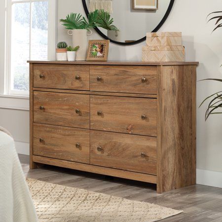 Have enough storage until the cows come home. This dresser from the River Ranch collection offers 6-drawer storage for any style of home decor. This bedroom dresser features six drawers on metal runners and safety stops. The lower four drawers of this 6-drawer dresser are extra deep, for thick sweaters, bulky denim, large linens, and more. Store socks, T-shirts, or other necessities in the top two drawers of this bedroom dresser, while the top surface provides additional storage for a jewelry bo Drawer Bedroom, Dresser Wood, Solid Wood Desk, Bedroom Dresser, Wood Dresser, Drawer Storage, Double Dresser, Thick Sweaters, 6 Drawer Dresser