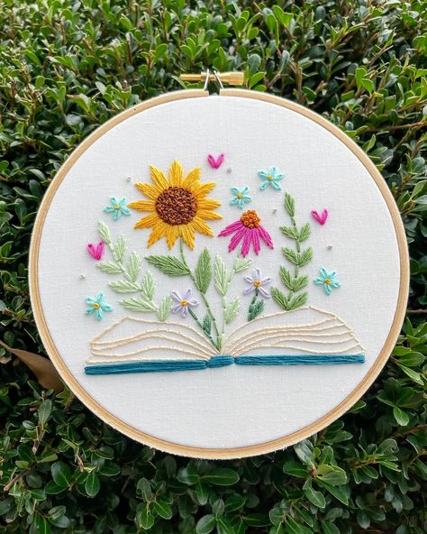 Fun fact: this hoop fell of the face of the planet until I realized that I literally filmed a video of myself putting it into a tote bag that I stitched. Lol. I was looking for it for days. 🙃 anyways, the pattern is available in my shop for the bookish girlies! 🫶🩷🫵📖🌻 Book Embroidery Design, Book Embroidery Pattern, Bookish Embroidery, Book Embroidery, Beautiful Sunflowers, Simple Stitch, Basic Embroidery, Tablet Screen, Stitch Guide