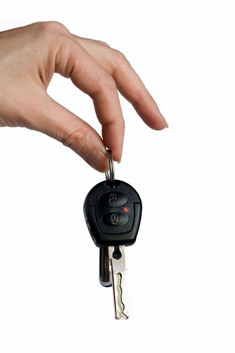 A woman holding car keys on a white background. We can all say that losing your car keys is one of the most stressful situations that could happen in our lives. People tend to feel emotional if they lose their car keys and react badly when this sort of situation occurs. It's a good thing for you that you came to the right place, we've researched how you can easily respond to this type of stressful situation. Check out the post and be informed of what you can do with this situation. Lost Car Keys, Buying New Car, Damaged Cars, Auto Body Shop, Electronic Lock, Auto Body, Car Keys, Car Buying, Background Image