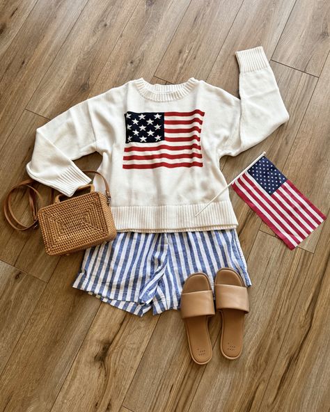 american flag sweater with blue striped boxer shorts and casual sandals. casual 4th of july outfits Red White And Blue Work Outfits, Fourth Of July Outfit Aesthetic, Casual Fourth Of July Outfit, 4th Of July Outfits Beach, Fourth Of July Outfits 2024, Usa Sweater Outfit, Trendy 4th Of July Outfit, Americana Summer Outfit, July Fourth Outfit