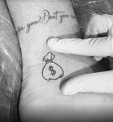 Small Money Tattoos For Men, Money Bag Finger Tattoo, Money Sign Tattoo Small, Tatuagem Mandrake, Money Bag Tattoo Design, Money Hungry Tattoo, Money Tattoo Design, Money Tattoo Designs, Cash Tattoo
