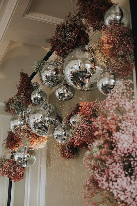 Wedding House Party Ideas, 30th House Party Decor, Modern Whimsical Wedding Dress, Hanging Disco Ball Floral Arrangement, Bridal Diy Decorations, Disco Hens Party Decorations, Funky Beach Wedding, Disco Tropical Wedding, Disco Balls With Flowers