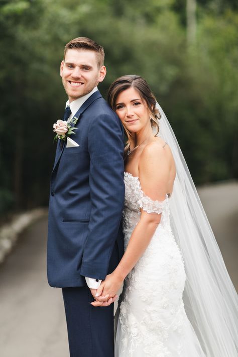 Bride wearing off the shoulder lace wedding dress with cathedral veil in a beautiful up-do with natural glam makeup. Groom wearing Navy suit with white and pink boutonnière. Photo taken at Whistle Bear in Cambridge Ontario by Sandra Monaco Photography.  #WeddingPose #VeilInspiration #CandidPosing #Posing #CouplePose #CandidWedding #Elegant #Romanticposing #PosingInspiration #CouplesPosing #RomanticWedding #WalkingPose #OffShoulderWeddingDress #WeddingDressInspo #WhistleBear Bride And Groom Classic Poses, Easy Wedding Photo Poses, White Wedding Photoshoot, Wedding Groom And Bride Pictures, Wedding Bridal Picture Ideas, White Wedding Couple Poses, Wedding Photo Ideas Tall Groom Short Bride, Wedding Photography Couple Poses, Wedding Photos Poses Bride And Groom