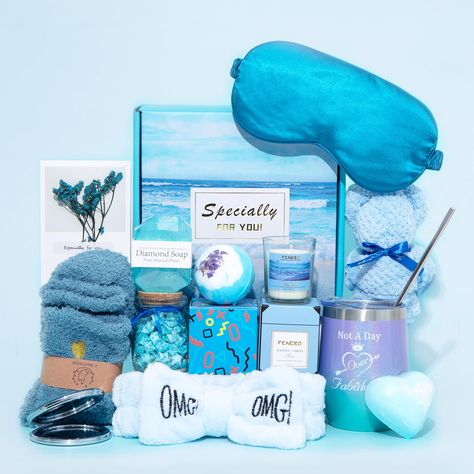 PRICES MAY VARY. 【Gifts for Her】：This is a gift basket that is sure to surprise the recipient. A well-matched blue gift set includes 1*12 oz Insulated Stainless Steel Tumbler (with straw), 1*Scented Candles，1*Pure Manual Soap，2* Bath Bomb，1* Bear Shaped Towel，1* Origami Lucky Star Jar，1* Sleep Eye Mask，1* Fuzzy Socks，1* Mirror，1* Cute Bow Headband，1* Greeting Card，and an exquisite gift box. 【Premium Material and Elegant Box】: Wine Tumbler is made of food-grade stainless steel with double insulat Spa Themed Gift Basket, Tropical Gift Basket, Blue Gift Box Ideas Birthday, Blue Gift Basket, College Gift Baskets, Gift Basket For Women, Pink Gift Basket, Star Jar, Unique Gift Ideas For Women