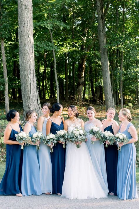 Bride with her Bridemaids dressed in different shades of blue Multiple Blue Bridesmaid Dresses, Saphire Dresses Bridesmaid, Bridesmaids In Different Shades Of Blue, Blue Dresses For Bridesmaid, Light And Dark Blue Bridesmaid Dresses, Braidsmaids Dresses Blue, Mixed Shades Of Blue Wedding, Different Shade Blue Bridesmaid Dresses, Navy And Light Blue Bridesmaid Dresses