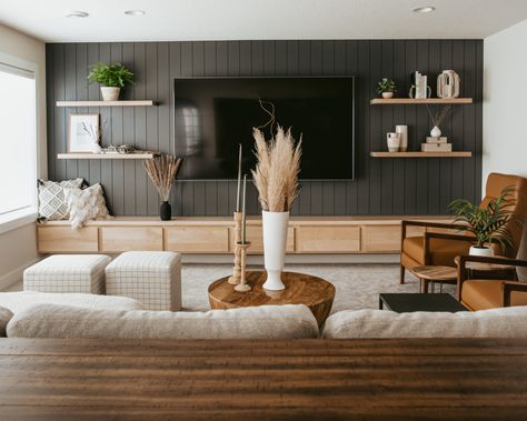 Basement Family Room No Windows, Neutral Home Aesthetic With Black, Living Room Tv Floating Shelves, Black And Cream Basement, Credenza With Tv Above, 55 Inch Tv Wall Design, Under Tv Seating, Southern California Living Room, Fill Large Wall Space Living Room