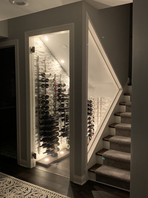 We converted our closet under the stairs to a cool wine cellar.  Turned out great! Glass Wine Room Under Stairs, Diy Glass Wine Cellar, Walk In Wine Closet, Wine Room Door, Space Under Basement Stairs Ideas, Under Stairs Wine Room, Under Stairs Closet Bar Ideas, Walk In Closet Under Stairs, Glass Wine Cellar Under Stairs