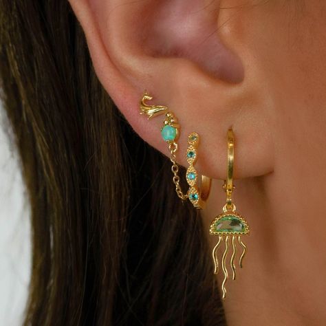 Green And Gold Earrings Stack, Non Tarnish Jewelry, Ear Chain Piercing, Oc Tattoo, Hippie Accessories, Surf Jewelry, Cool Ear Piercings, Cute Ear Piercings, One Earring